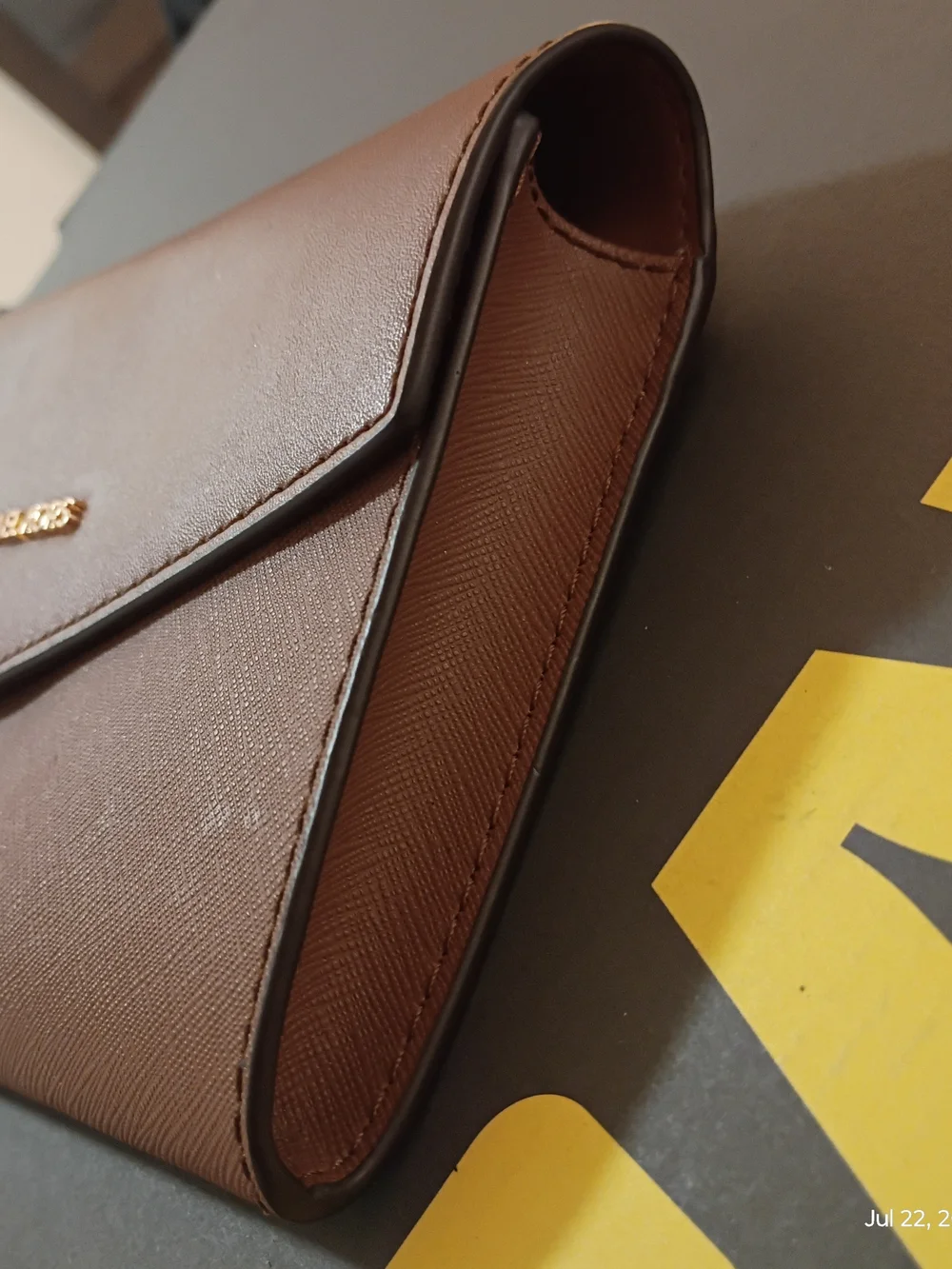 Michael Kors tan leather envelope clutch with gold logo